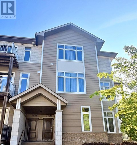 A two-story residential building with a balcony on the second floor.