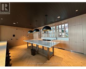 A conference room with a long table and chairs.