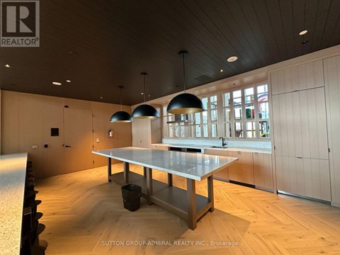 A conference room with a long table and chairs.