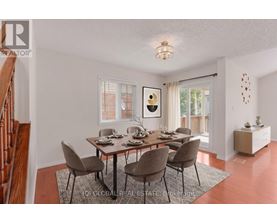 A dining room with a table set for six.