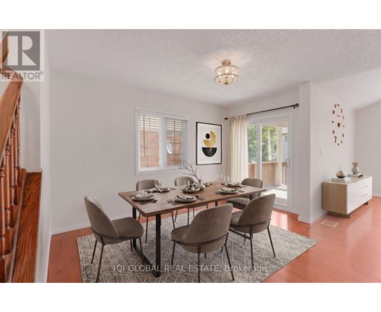 A dining room with a table set for six.
