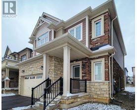 A house with a stone facade and a garage.