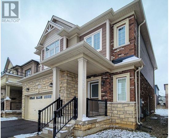 A house with a stone facade and a garage.
