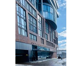A modern building with a glass facade and a curved section.