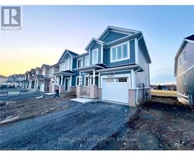 A row of houses with the first one being a two story house with a garage.