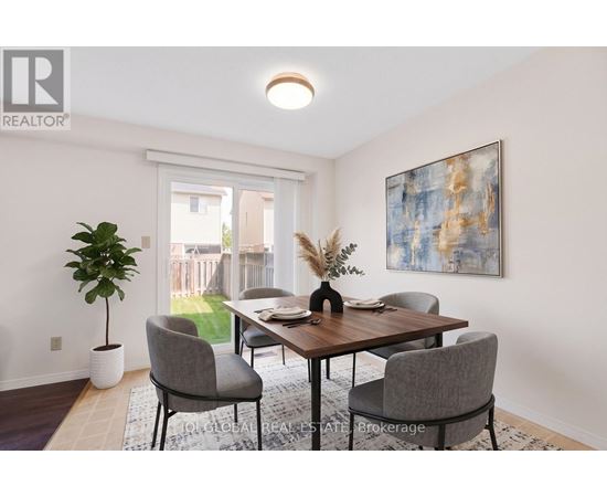 A dining room with a table and chairs.