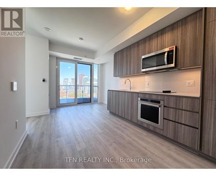 A modern kitchen with a microwave above the oven.