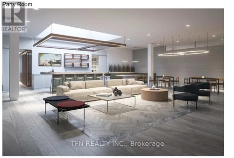 A modern party room with a large couch, a coffee table, and a long table with chairs.