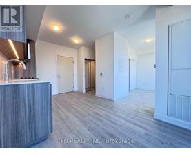 A realtor's office with a reception desk and a sign that says "TEN REALTY INC., Brokerage".