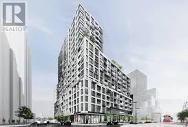 A modern building with a glass facade is depicted in the image.