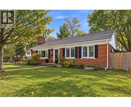 A house with a red brick exterior and a white front door.