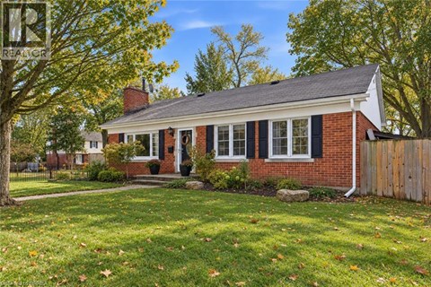 A house with a red brick exterior and a white front door.