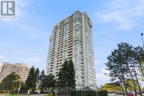 A tall residential building with balconies on the 10th floor and above.