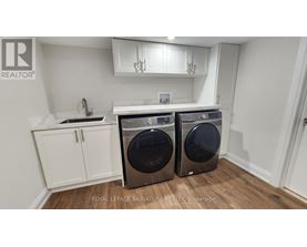 A laundry room with a washer and dryer.