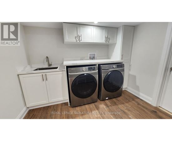 A laundry room with a washer and dryer.