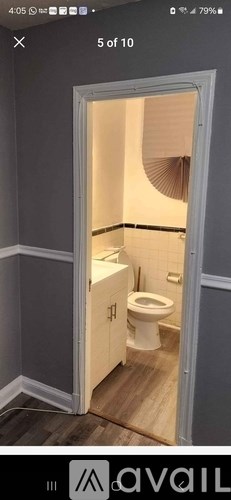 A bathroom with a toilet and sink is shown.