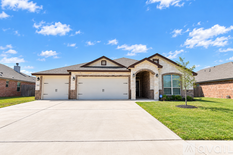 A house with a garage and a driveway.