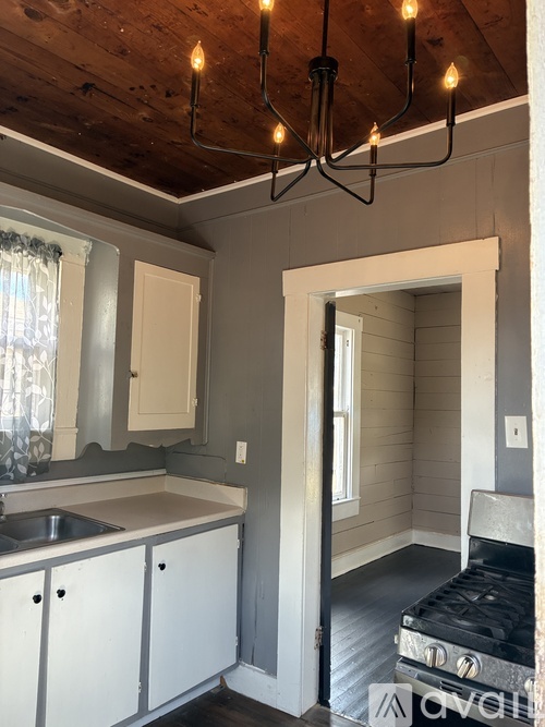 A small kitchen with a sink and a stove.