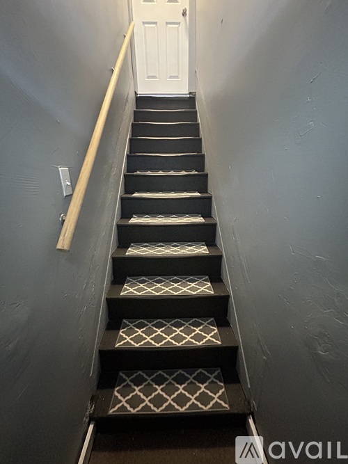 A staircase with a diamond patterned tread.