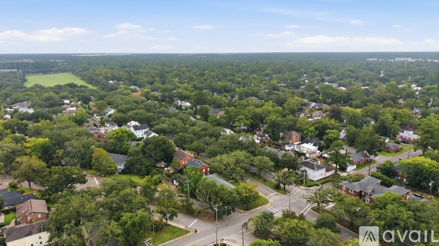 A bird's eye view of a residential area with houses and trees.