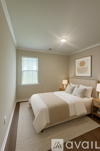 A bedroom with a large bed and a window.