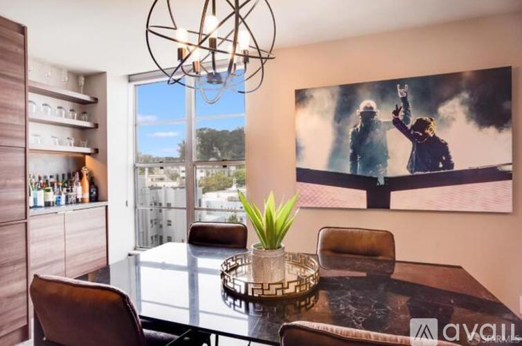 A modern dining room with a large poster on the wall.