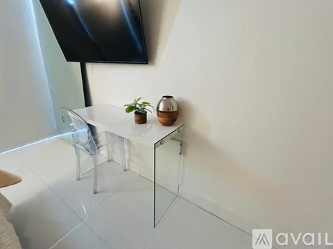 A small table with a plant on it.