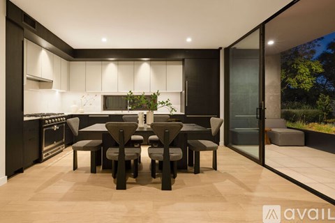 A modern dining area with a table set for four.