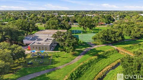 A park with a playground and a basketball court.