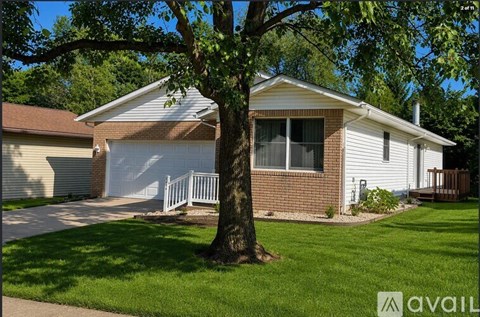 A house with a tree in front of it.