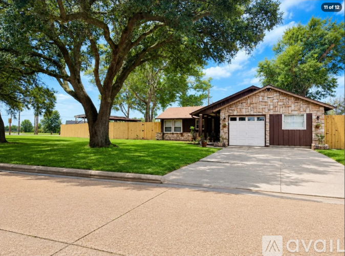 A house with a brown garage door is for sale.