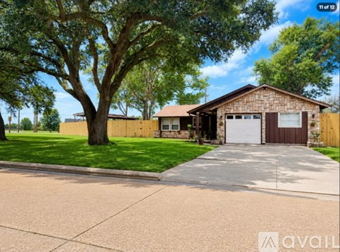 A house with a brown garage door is for sale.
