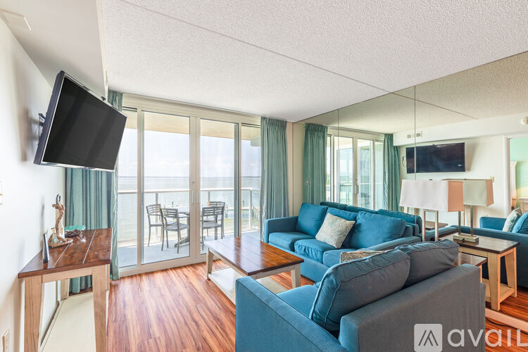 A living room with a television and a couch.