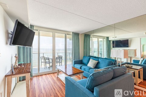 A living room with a television and a couch.