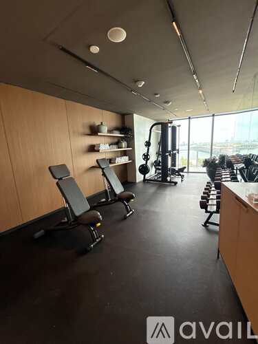 A gym with treadmills, weights and exercise machines.