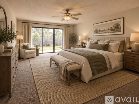 A bedroom with a large bed, a dresser, a chair, and a ceiling fan.