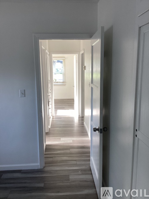 A hallway with a light at the end.