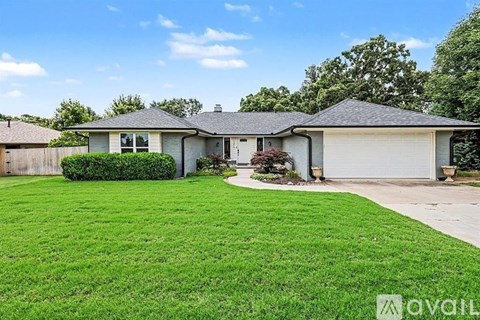 A house with a well-maintained lawn is for sale.
