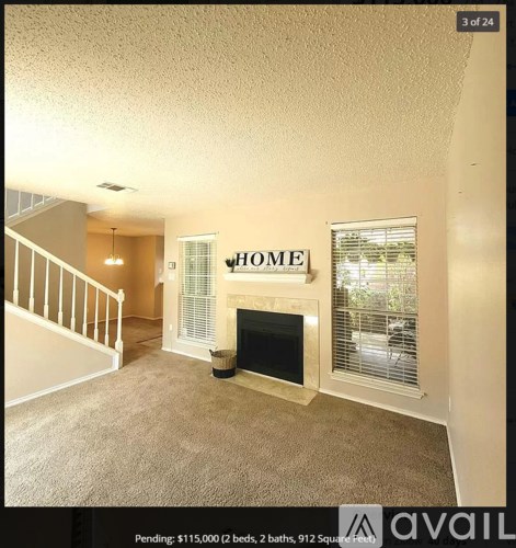A living room with a fireplace and a sign that says "HOME".