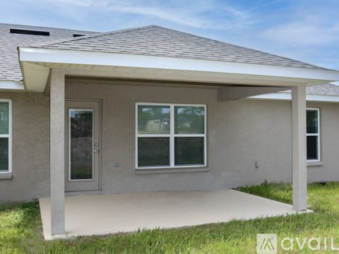 A house with a covered porch and a glass door.