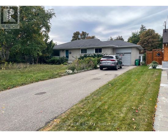A house with a car parked in front of it.