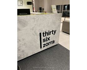 A reception desk with the words "thirty six zorra" on it.