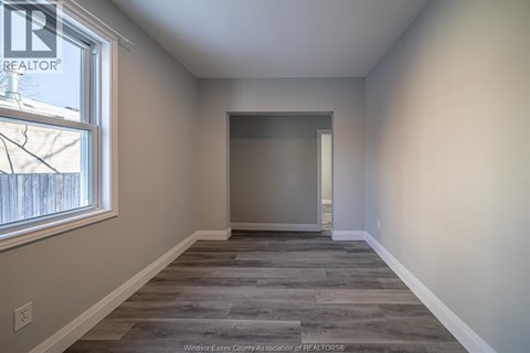 A room with a window and a door is shown.