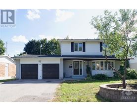 A two-story house with a garage is for sale.