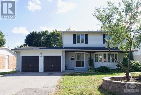 A two-story house with a garage is for sale.