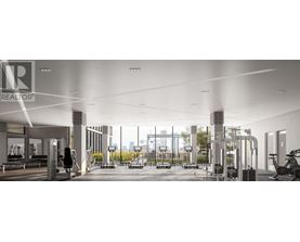 A gym with a row of treadmills and a row of exercise bikes.