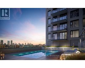 A modern apartment building with a pool and lounge chairs on the roof.