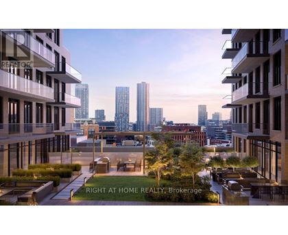 A modern cityscape with buildings and a clear sky.