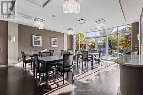 A dining room with a table set for six.