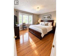 A bedroom with a large bed and a television.